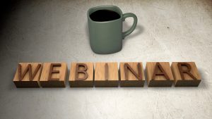 image of coffee cup with block letters that spell webinar