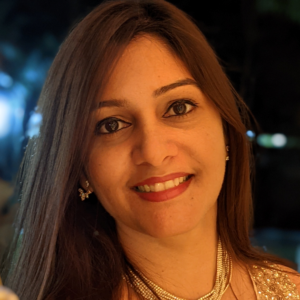 headshot of smiling woman with long straight dark hair