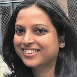 headshot of smiling woman with long dark hair