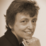 headshot of smiling woman with short dark hair