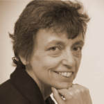 headshot of smiling woman with short dark hair 