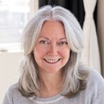 Headshot of smiling woman with long hair