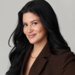 head shot of smiling woman with long dark hair