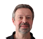 headshot of man with short hair and short beard and mustache